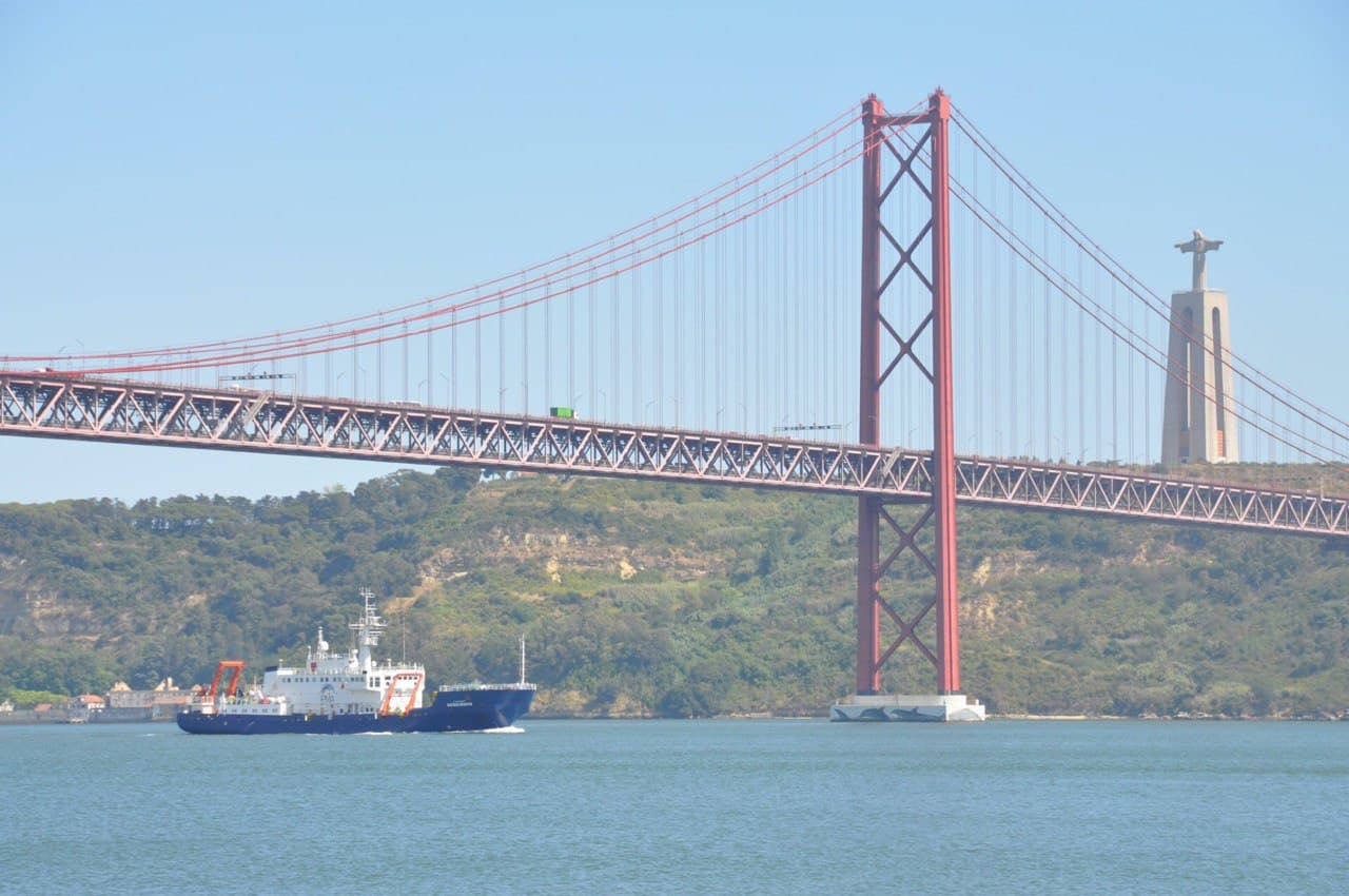 The Mario Ruivo in front of the 25th of April bridge and the Christ the Redeemer statue.